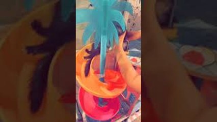 Ferret Swirls Down Dollhouse Slide