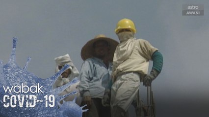 Pekerja asing mungkin dikenakan memakai lencana saringan COVID-19