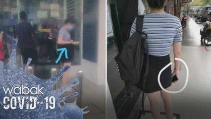 Polis sedang mengesan wanita memakai gelang pink di sebuah bank