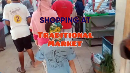 Shopping with wife and children at the traditional market