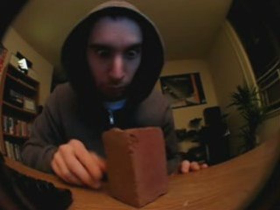 Weirdo Playing with Red Brick