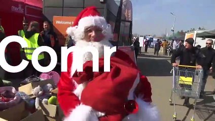Children welcomed at Polish border by Santa Claus