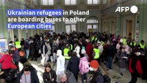 Ukrainian refugees board buses to European destinations