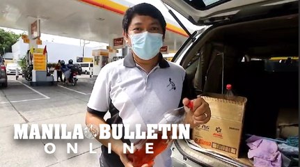 Engineer fills his SUV’s gas tank with filtered used cooking oil