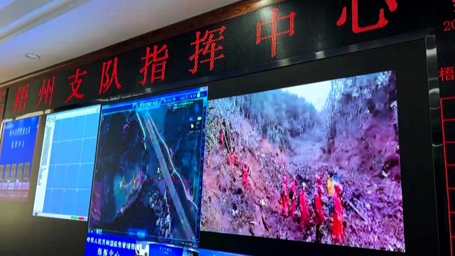 Rescuers rush to the plane crash site in southern China