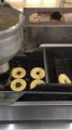 Donut King making donuts