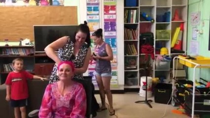 Kym shaves her trademark pink locks