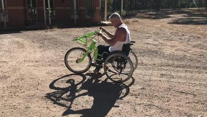 Owen Telford rides a wheelchair string bike