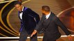 Will Smith punches Chris Rock on stage at the Oscars