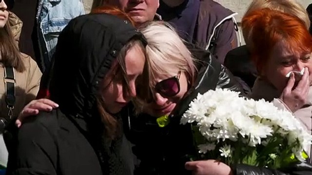 Mourners in Lviv line streets for fallen Ukrainian soldiers