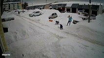 Massive Amount of Snow Slides off Roof Near Family