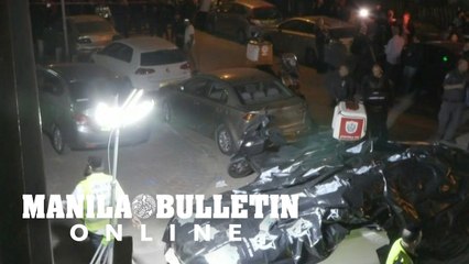 Israelis gather on site of an attack that killed five near Tel Aviv