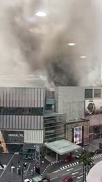 Thick smoke billowing from the roof of the Pavilion Kuala Lumpur