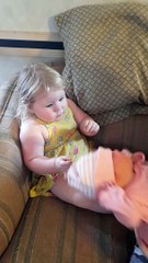 Holding Her Newborn Sister for the First Time
