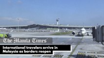 International travelers arrive in Malaysia as borders reopen