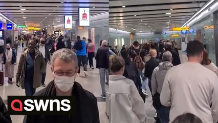 Passengers stuck in long queues at Heathrow Airport