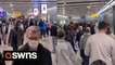 Passengers stuck in long queues at Manchester Airport