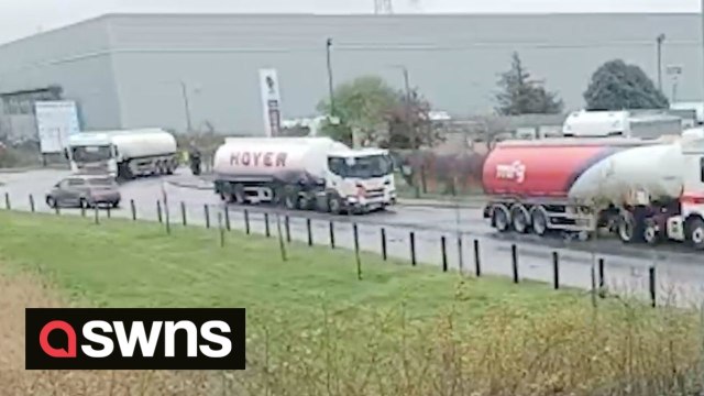 Oil tankers leave depot with police escort as protesters arrested for allegedly trying to block shipments