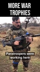 TROPHY MACHINEGUN- Ukrainian soldier displays a Russian PKP machinegun