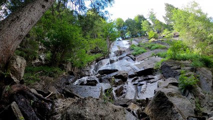 SMALL WATERFALLS ON MOSSY ROCKS