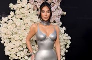 Kim Kardashian holds hands with Pete Davidson at Kardashians premiere