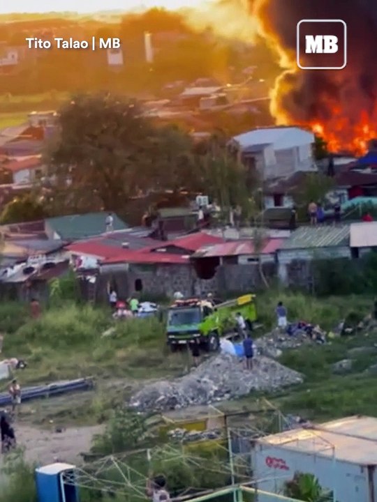 Firefighters battle a late afternoon blaze in a residential area in Karuhatan, Valenzuela