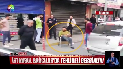 Suriyeli dükkan sahibi polisin yanında yoldan geçenlere tehditler savurdu