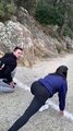 Girl Running Against Friend in Mountain Race Trips Over Her Foot