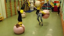 Acrobats Perform Flips in Sync With Gym Balls