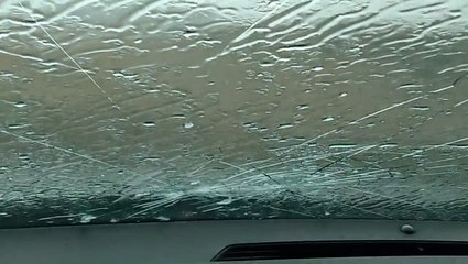 Large hail cracks storm chaser's window