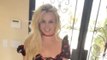 Britney Spears models outfits before her baby bump starts to show