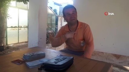 Çiçek diktiği parkta bulduğu para dolu çantayı polise teslim etti