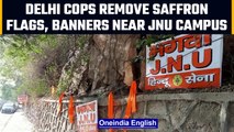 Delhi: Cops remove saffron flags, banners put up by Hindu Sena near JNU campus | OneIndia News