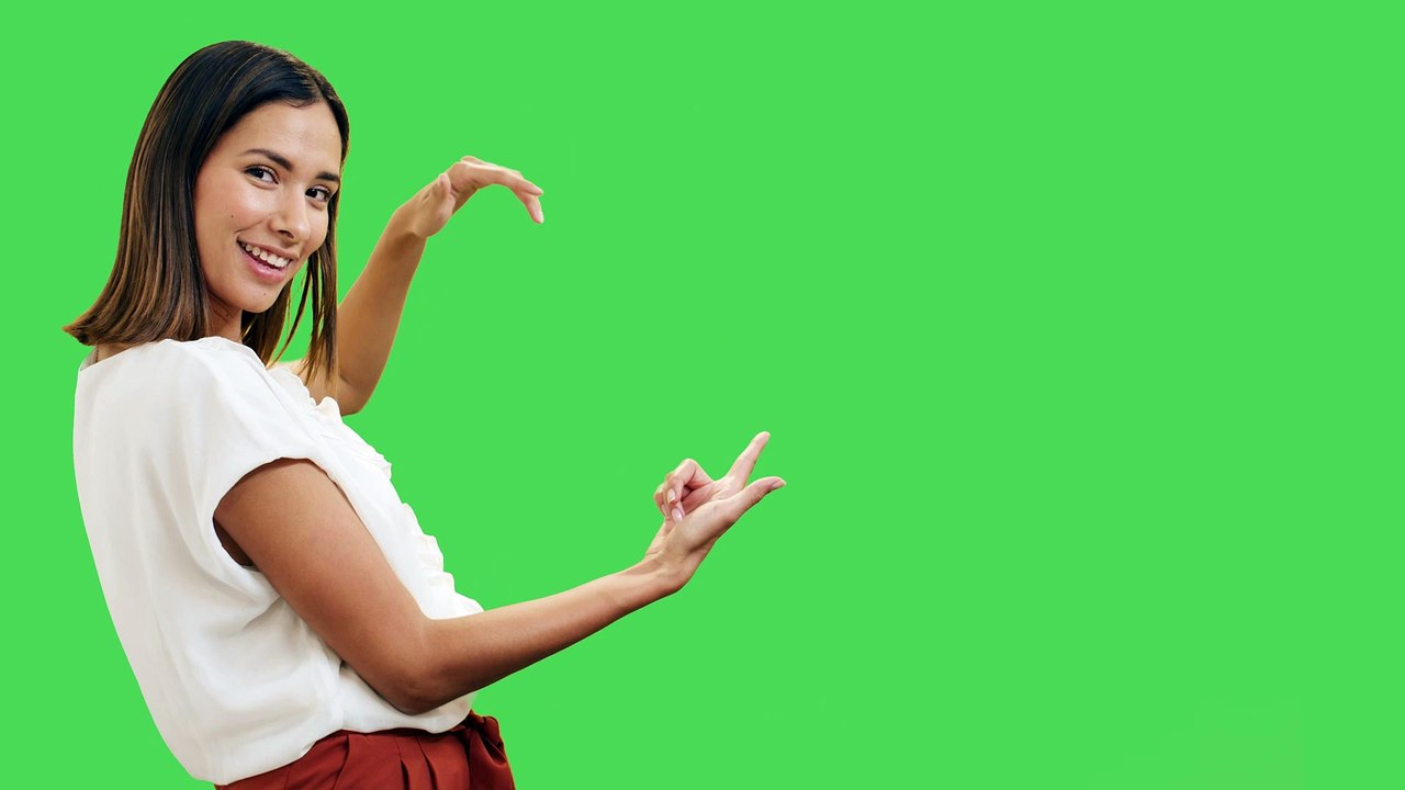 mixkit-woman-presenting-something-with-chroma-background-42635