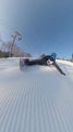 Snow Skier Glides Down Slope With Steep Board Inclination