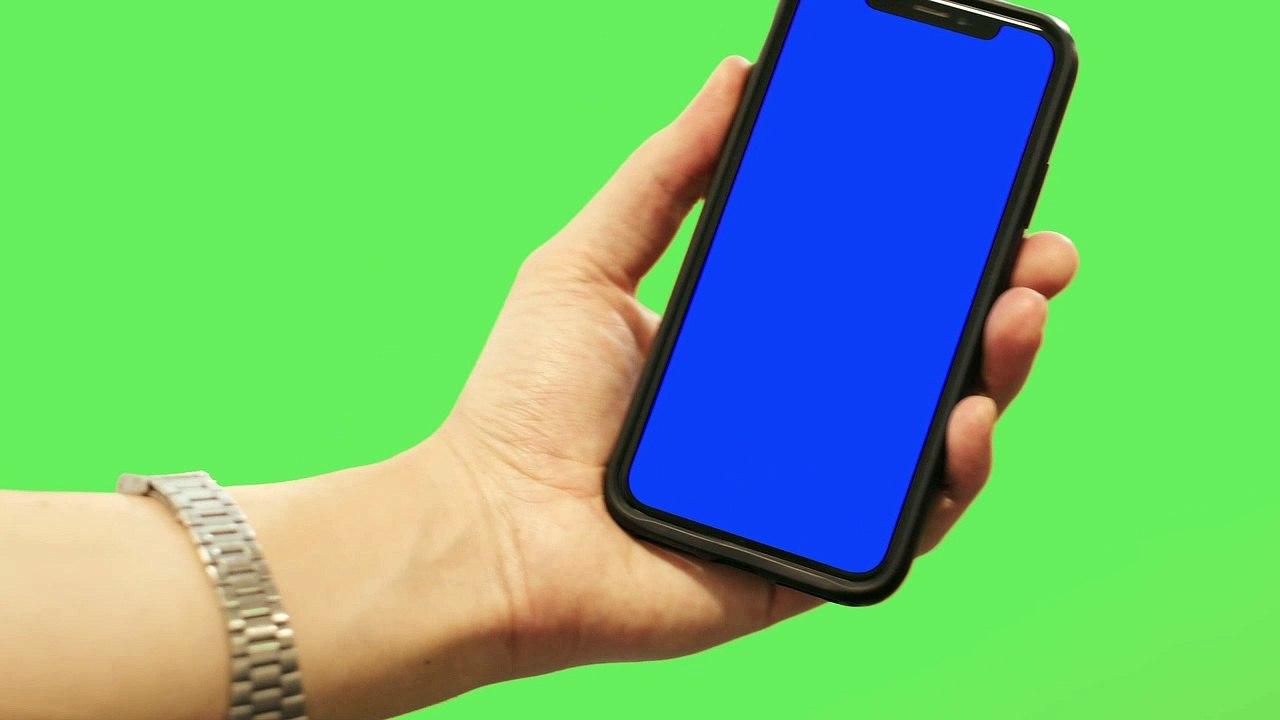 mixkit-chroma-on-a-smartphone-with-a-green-screen-background-42636