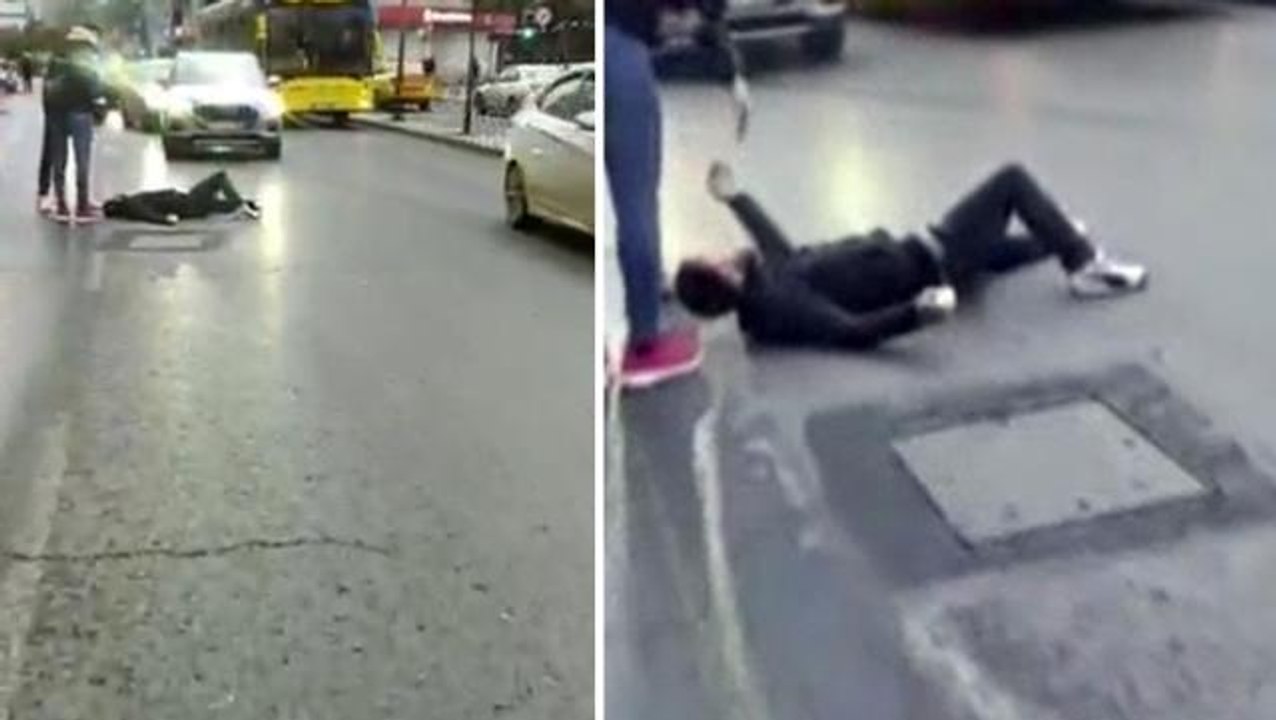 Kendini seyir halindeki araçların önüne atan dilenci pes dedirtti