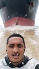 Cruising in Front of a Massive Cargo Ship