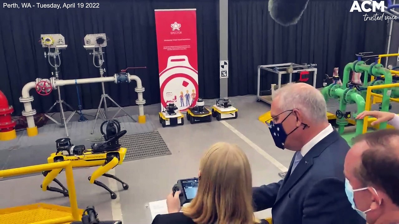 Scott Morrison plays with remote control robot dog on Day 9 of federal election trail | April 19 2022 | Canberra Times