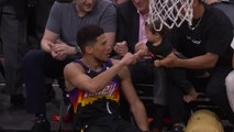 Booker fist bumps baby after sinking fadeaway three
