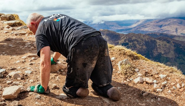 A double amputee scaled the highest mountain in the UK in just 12 hours - by crawling