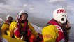 This incredible footage shows RNLI crews rescuing a stranded dog walker - who almost drowned after becoming separated from his family on a sandbank.