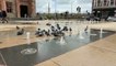 Pigeons playing in the fountains in the Guildhall Square.
