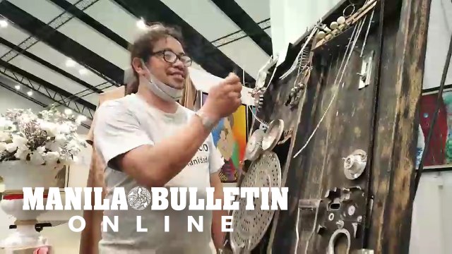 Artist Noy Narciso demonstrates his improvised musical instruments in Davao City