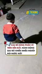 Cậu bé dùng phấn vẽ trên nền đất, hành động sau đó gây xúc động