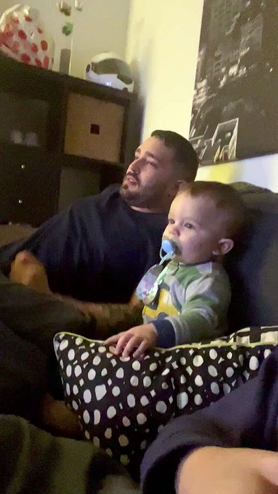 Baby Drops Pacifier and Takes Bread From Dad