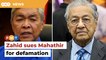 Zahid sues Mahathir for defamation over claim he sought help to drop corruption charges