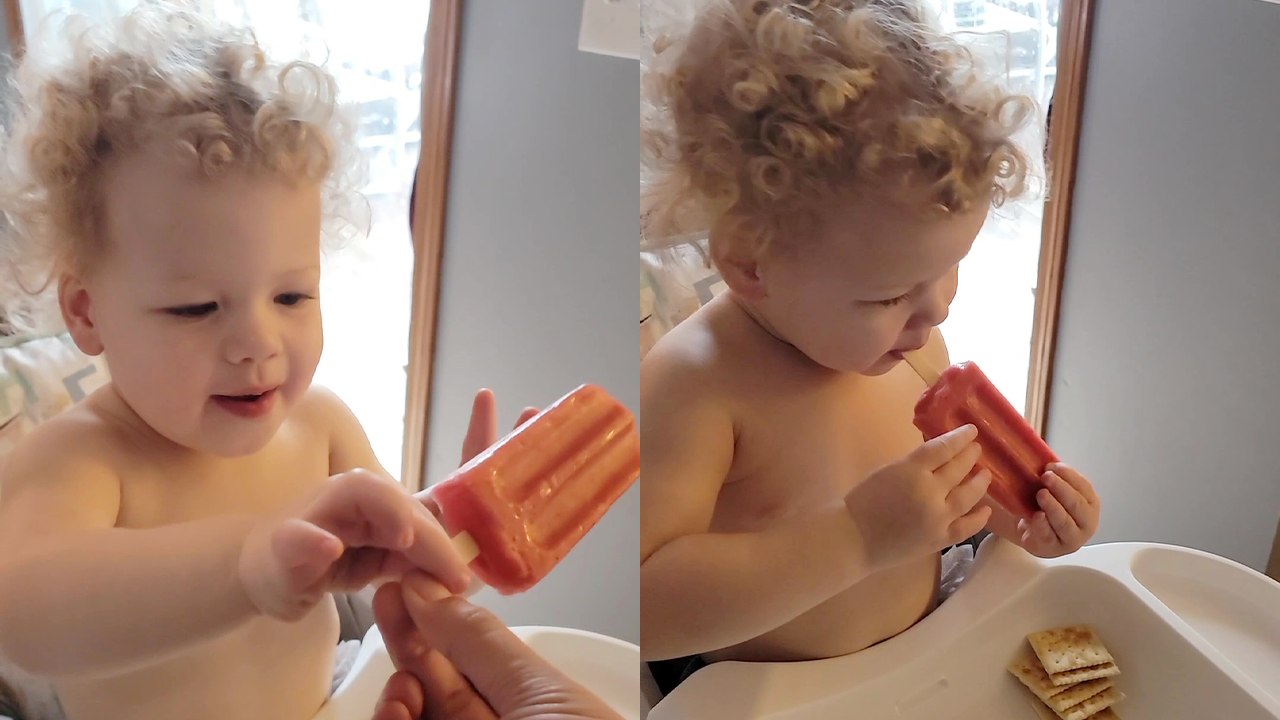 'Curious toddler tries a popSICle for the first time '