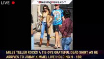 Miles Teller rocks a tie-dye Grateful Dead shirt as he arrives to Jimmy Kimmel Live! holding h - 1br