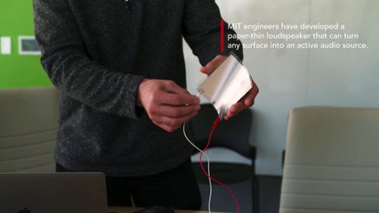 A paper-thin loudspeaker plays  'We Are the Champions'  by Queen